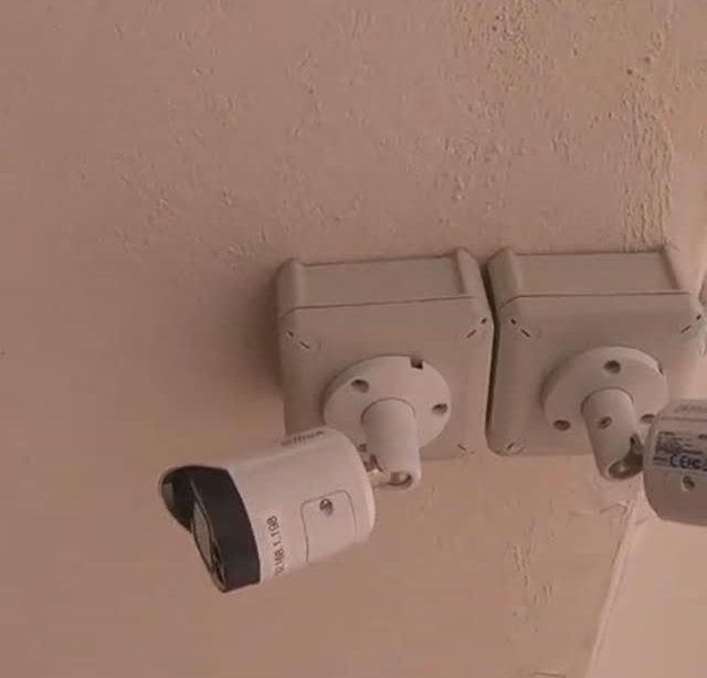Two IP cameras mounted on a school wall